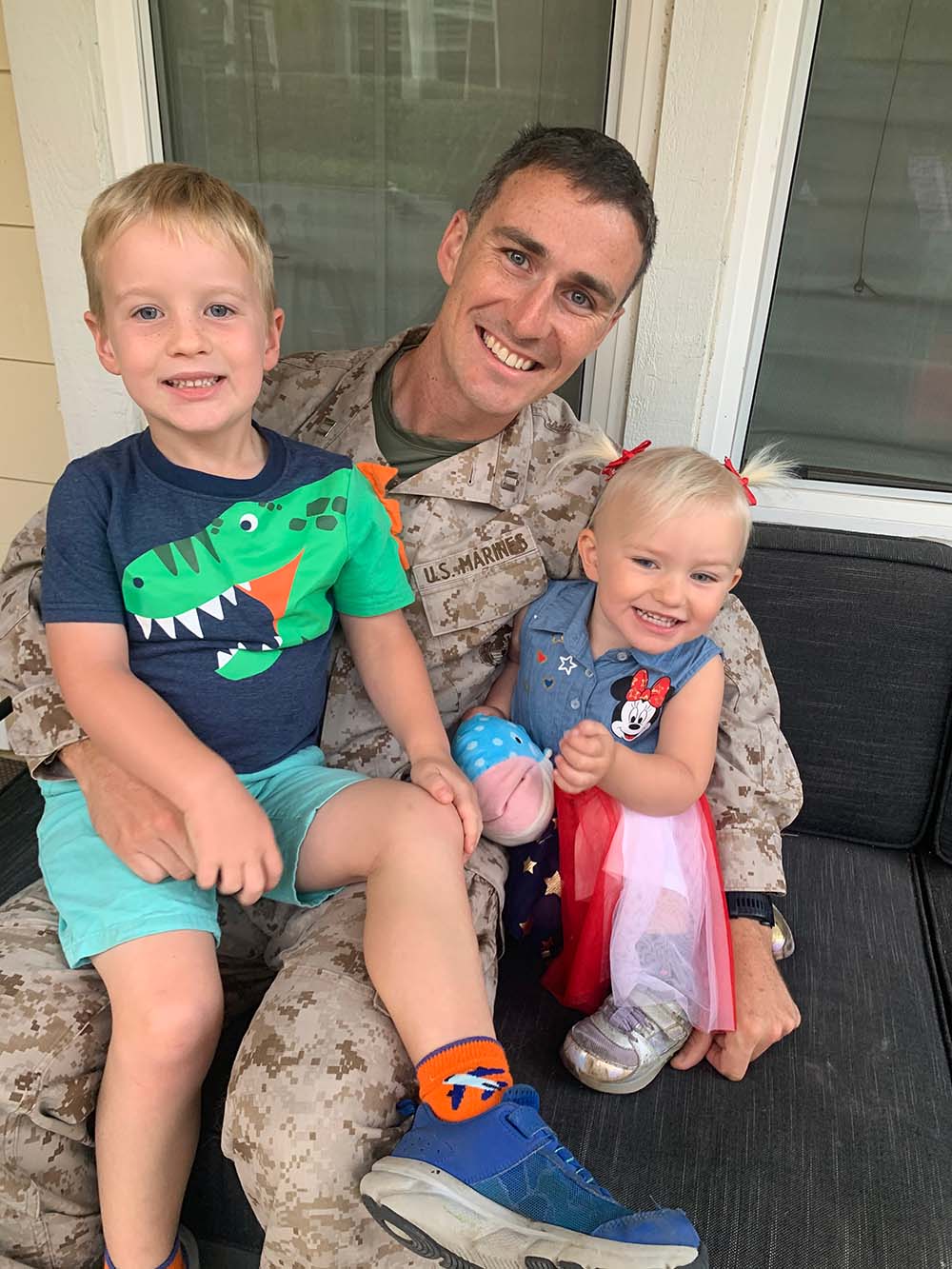 Service member and two kids photo