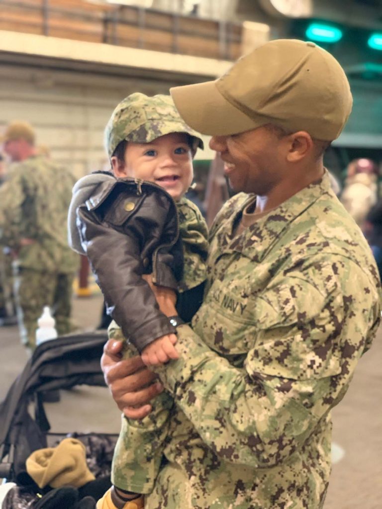 Service member and young boy