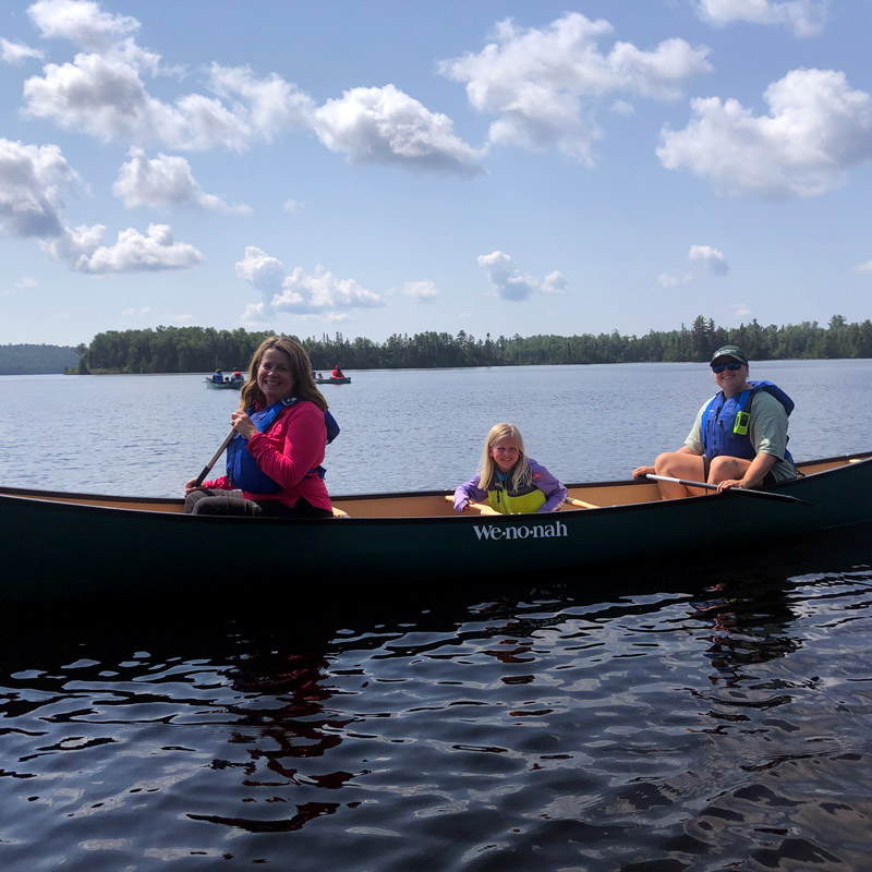 family canoeing at boundary waters