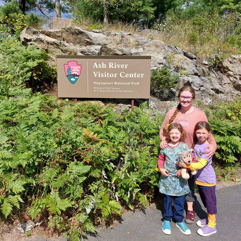 mother and children posing in front of Voyageurs National Park